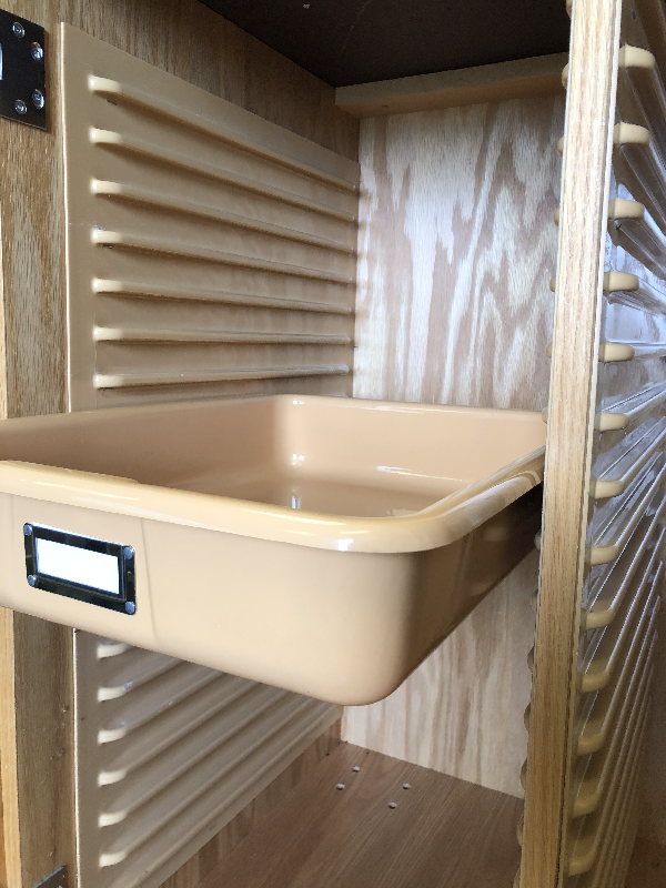 Shirley K's panel tray slide system with plastic storage trays