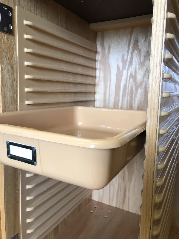 Shirley K's panel tray slide system with plastic storage trays