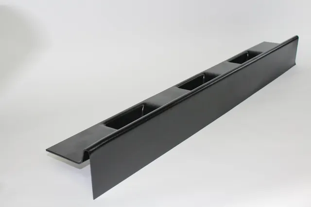 Long black thermoformed channel by Shirley K's with formed pockets and a flange