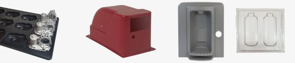 Custom thermoformed parts by Shirley K's: a dunnage tray holding cast parts, a red enclosure cover, a gray housing and a clear two-pocket part